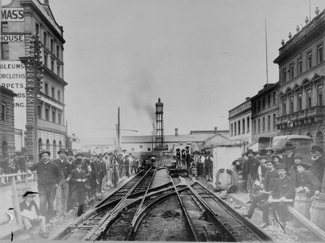 Laying tram tracks on Elizabeth St looking toward Flinders St Station, circa 1910